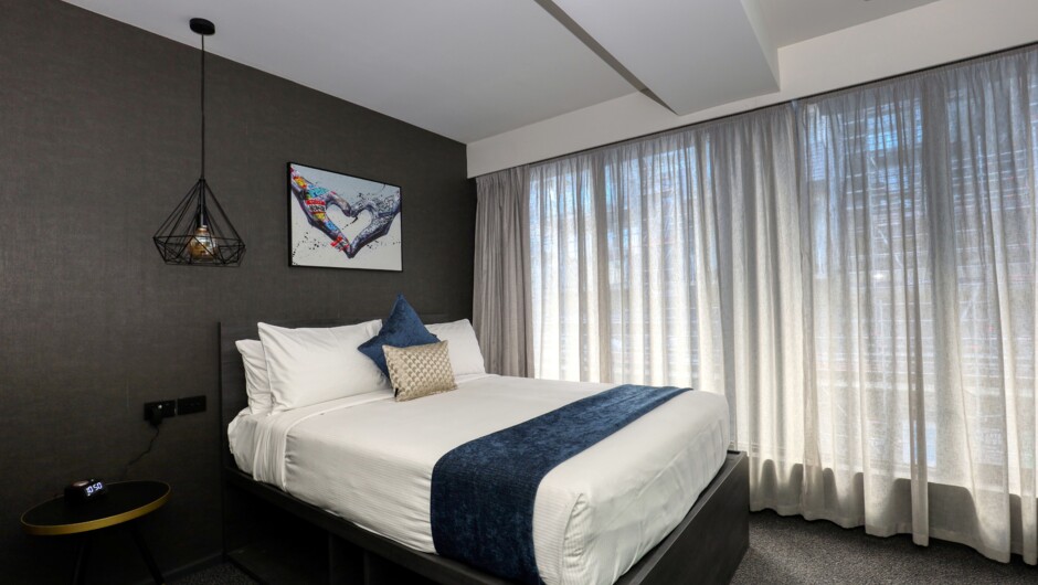 Our Deluxe Queen rooms feature a queen-sized bed with plenty natural light, wireless internet, Smart TV with streaming and ensuite with shower only.