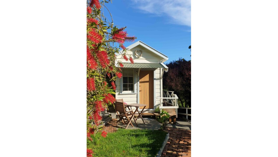 Our cosy garden cottage with private outdoor seating.