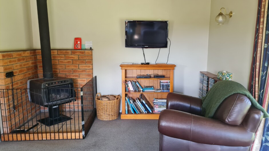 Cosy log burner plus heat pump. Lots of DVD's.