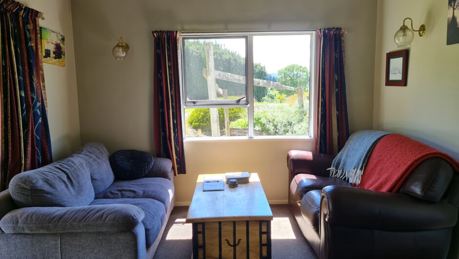 Comfortable seating in the open plan lounge with board games in the coffee table for colder days.