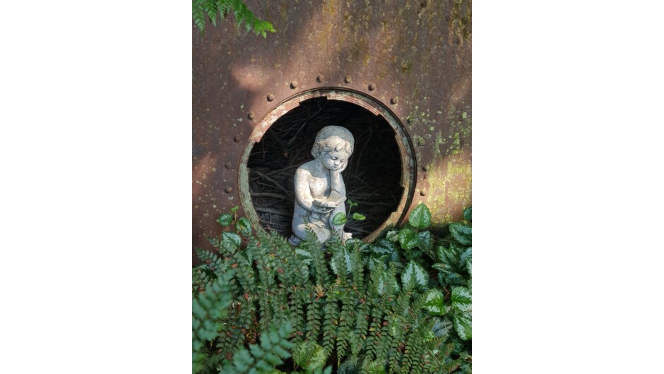 A little bit of whimsy pops up in places along the pathways and amongst the plants.