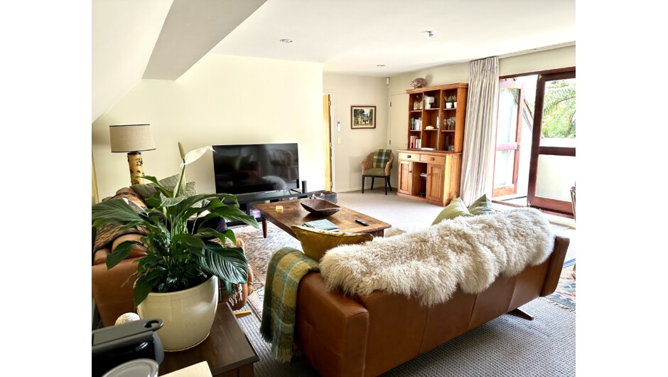 Okuta Bay Retreat - 2 Bedroom Garden View Suite Living area opening onto private balcony overlooking native ferns and gardens