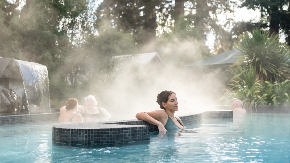 Unwind in our peaceful cascade pools surrounded by native gardens, featuring a natural sulphur pool and an easy-access beach-style pools.