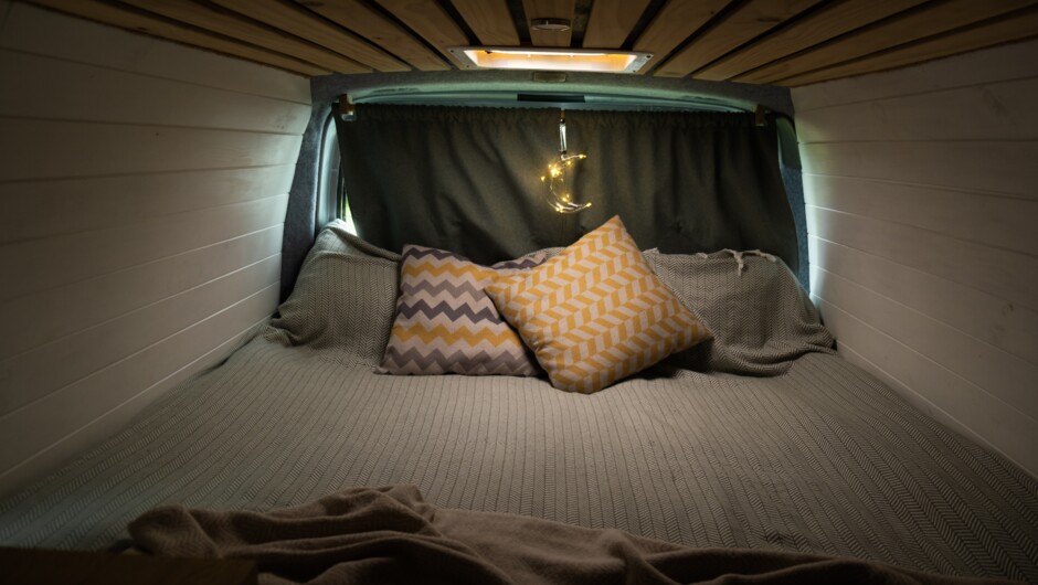 Bed with curtains drawn