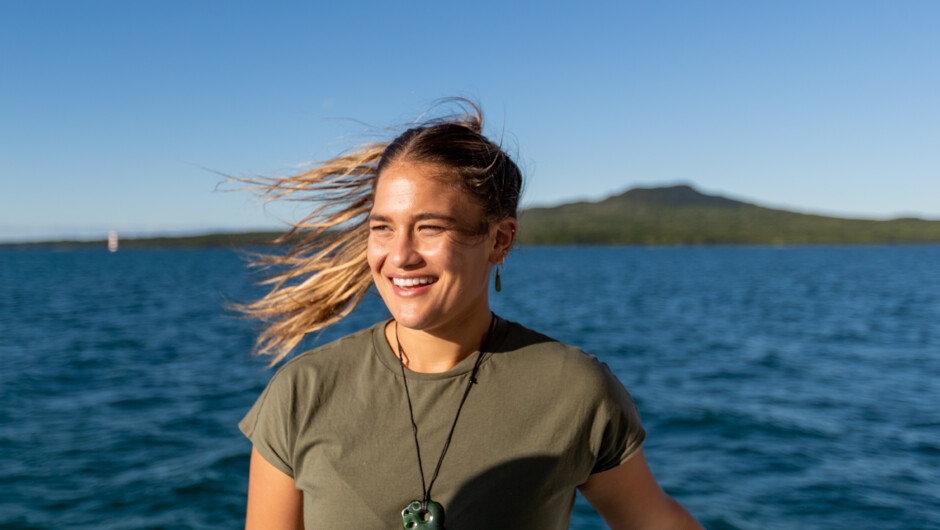 Women smiling with Rangitoto Island behind