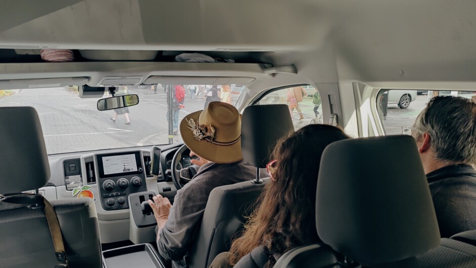 Being a passenger in the van.