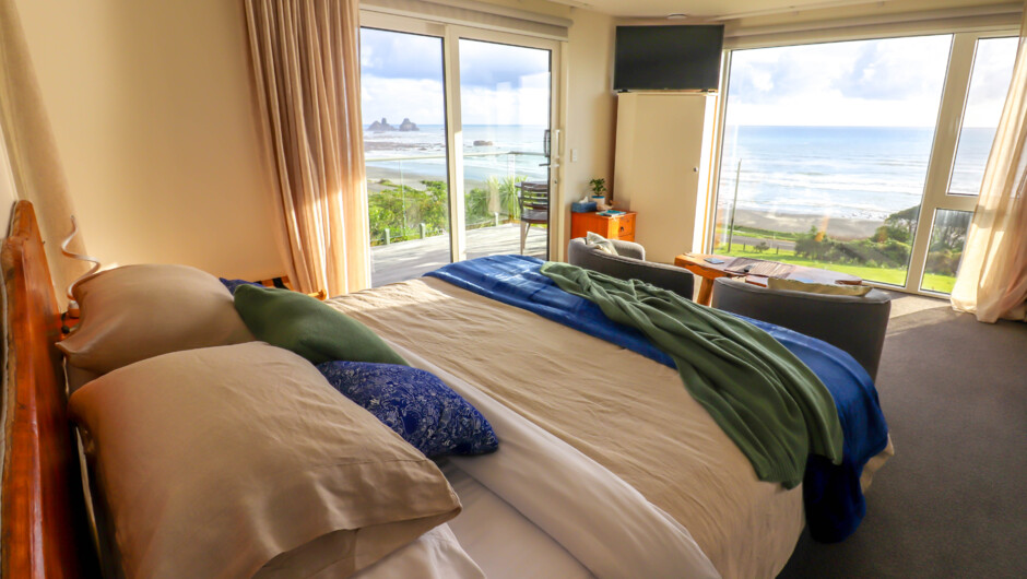 Floor-to-ceiling windows let you enjoy the view from your room and bed