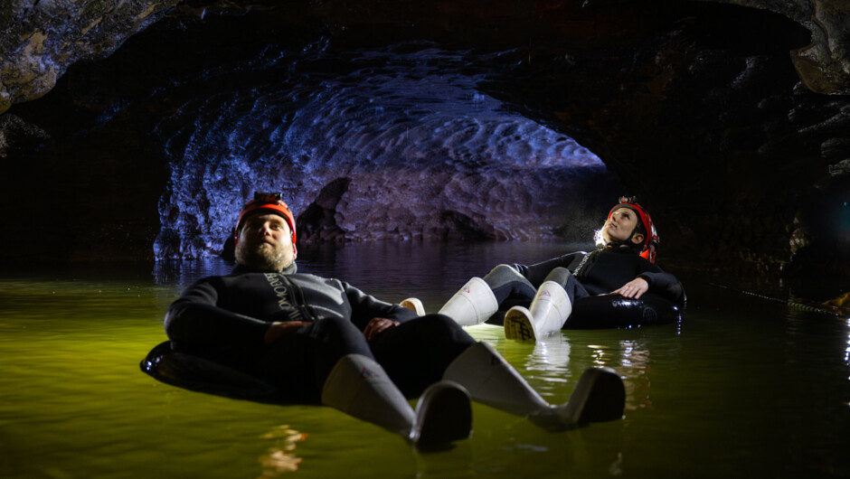 Black water raft (float on tubes) beneath thousands of glowworms