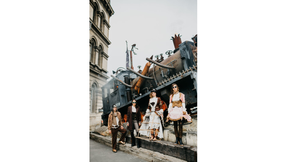 Steampunk models beside train