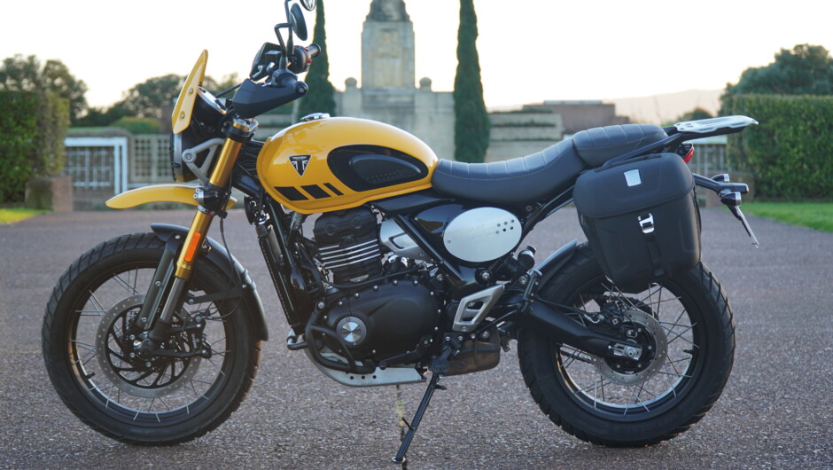 Triumph Scrambler 400 XC with luggage, available for motorcycle hire from Rideworks in Auckland.