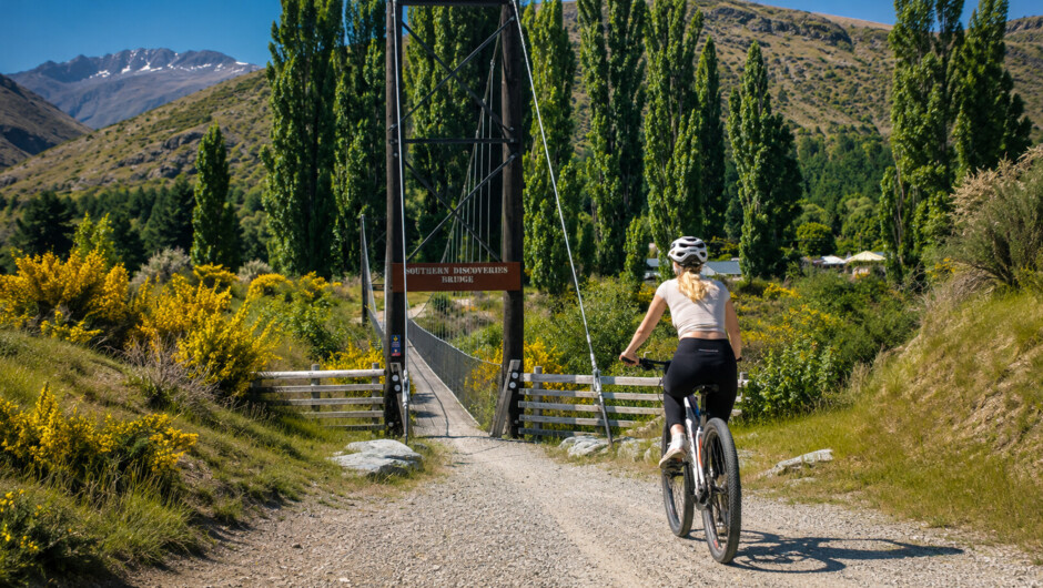 E-Bike the spectacular Arrow River Trail from historic Arrowtown towards Gibbston wine country
