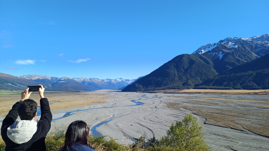 Taking in the view of the Waimakariri River on an Arthurs Pass Day tour with Adventure By Nature