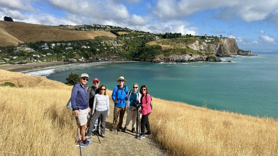 People walking at Godley Head above Taylors Mistake