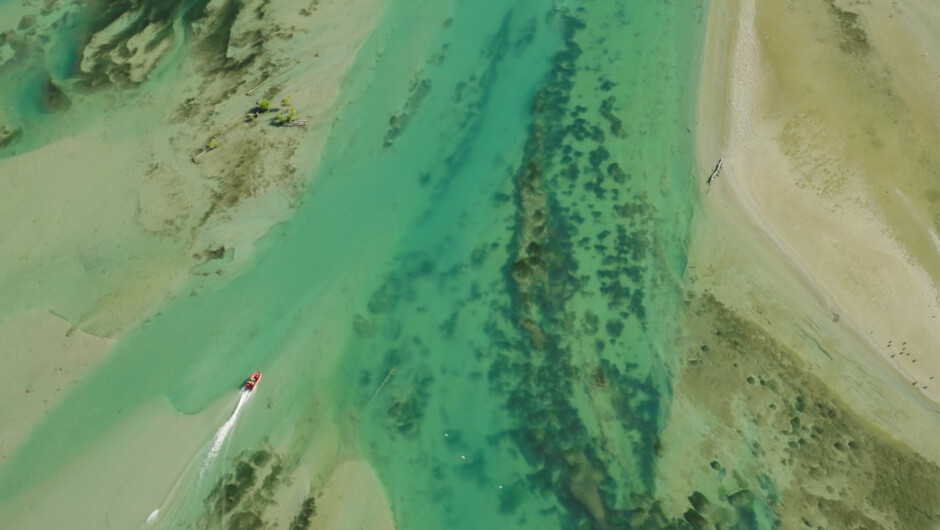 Inflatable Jet Boat cruising up shallow river