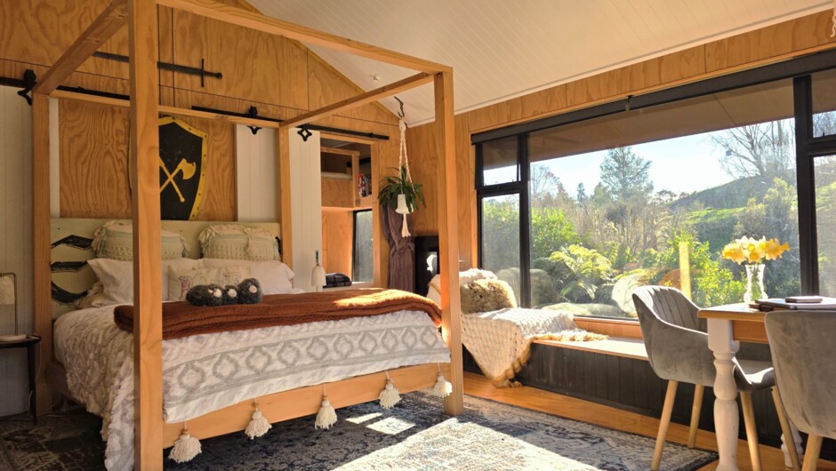 Handcrafted four-poster bed designed for deep rest and slow, unhurried mornings.