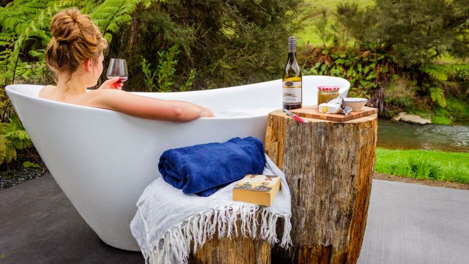 Relax in the outdoor bath overlooking the river with spectacular Milky Way skies at night