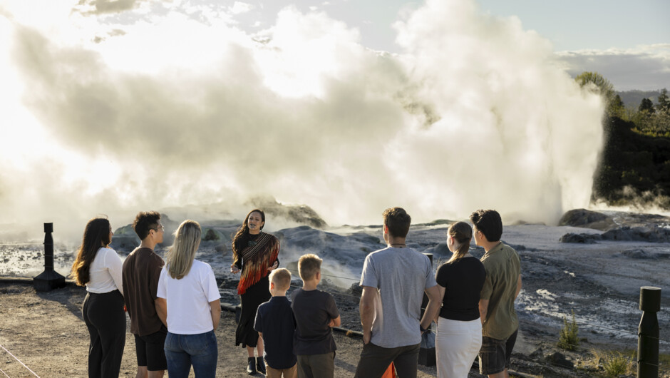 Guide Infront of Pōhutu Geyser with group