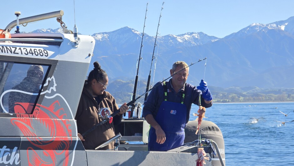 Your friendly skipper Malcolm helping to bring in your catch.