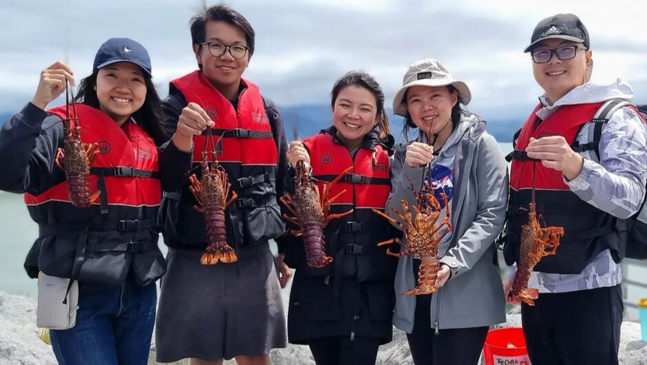 Celebrating a great catch of Kaikōura's famous crayfish.