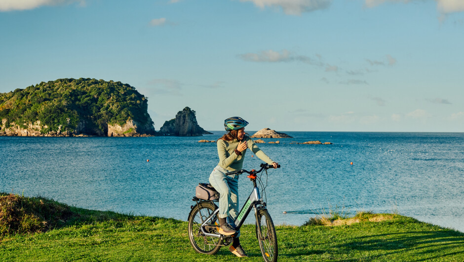 French woman on the water front at Tasman holiday resort, Hahei