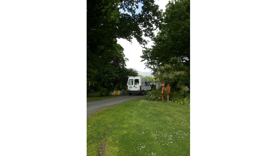 Van driving into camp