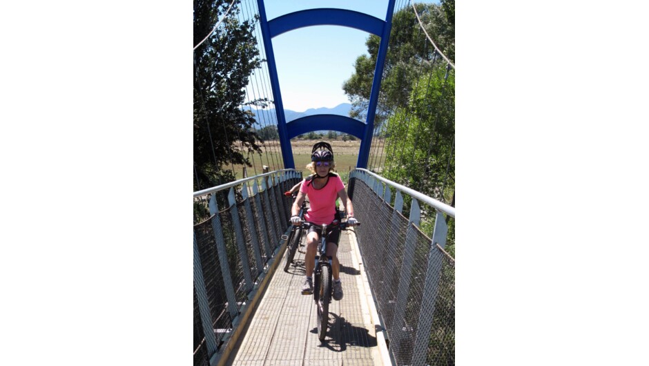 Crossing the Waimea River Suspension bridge on the Great Taste Trail