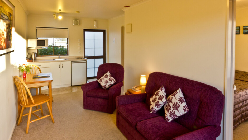 A one bedroom unit with lounge and kitchen area as well as the bathroom.