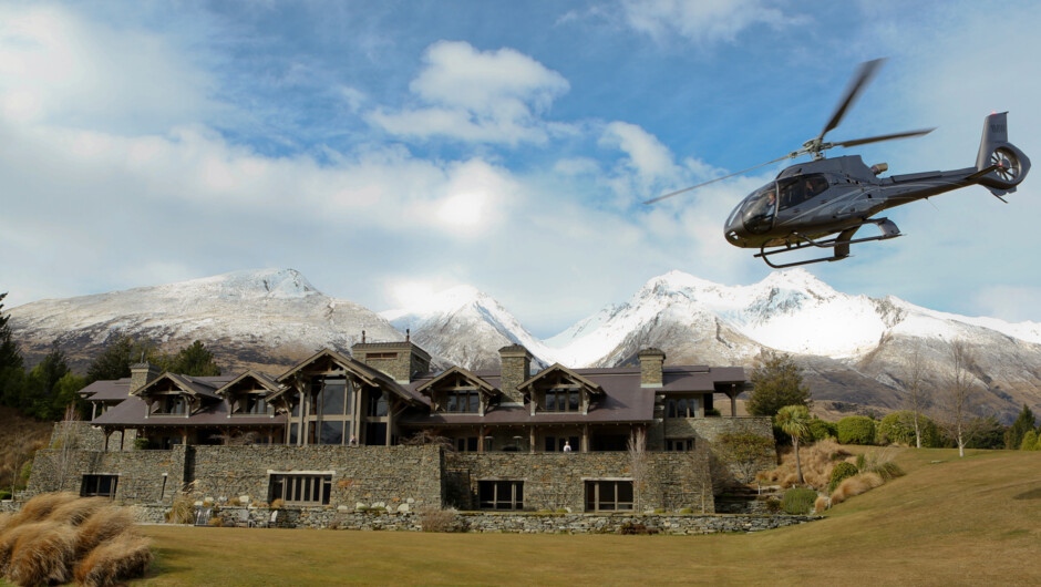 The Airbus H130 arriving at luxury lodge, Blanket Bay.