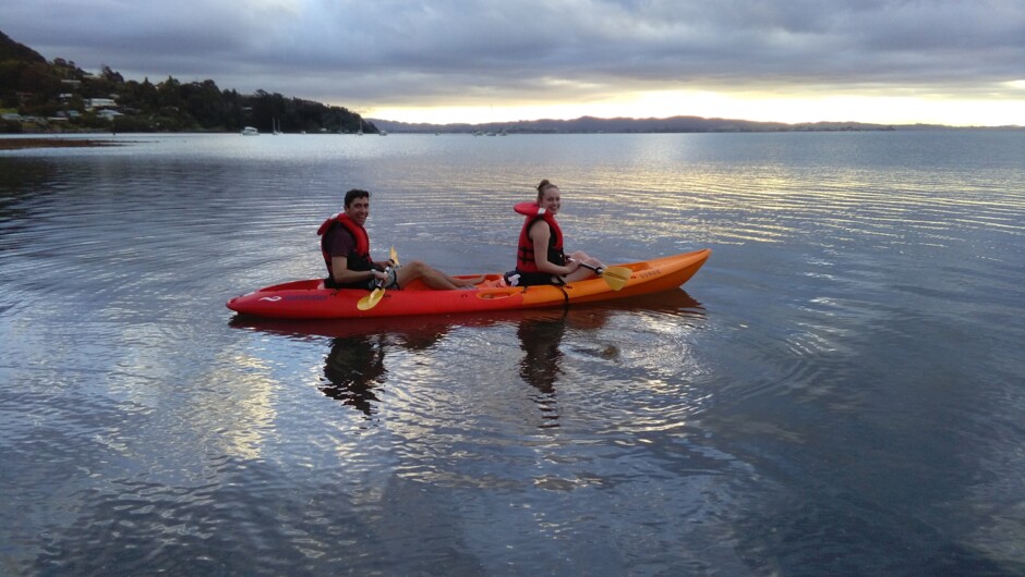 Guests enjoying the free use of the kayak as the sun is setting.