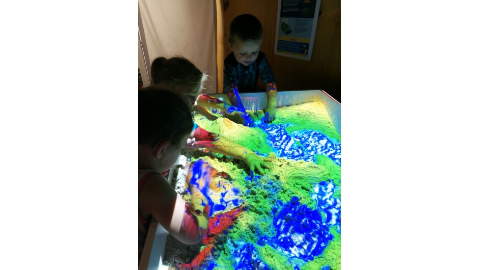 Kids enjoying the augmented reality sandbox