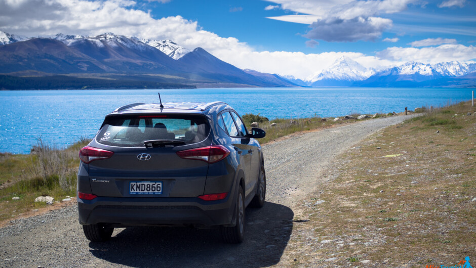 Snap Rentals SUV at New Zealand lake