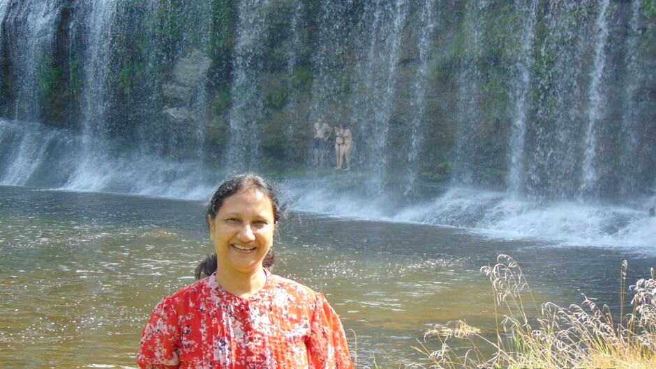Curtain Waterfalls. See people bathing behind the falls
