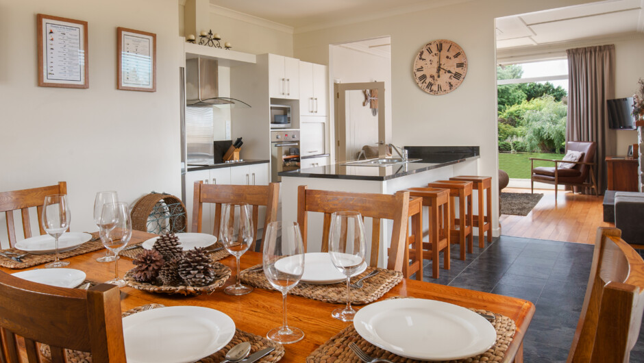 The open plan kitchen dining area is modern and bright.