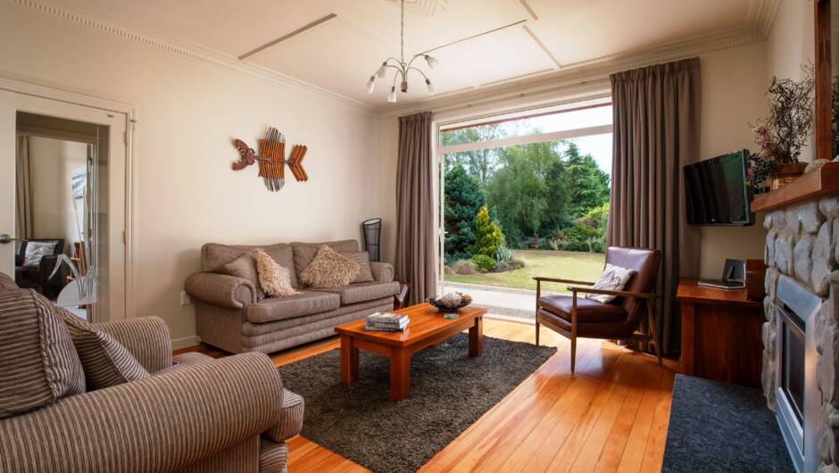 The comfortable lounge room looks into the large private garden.
