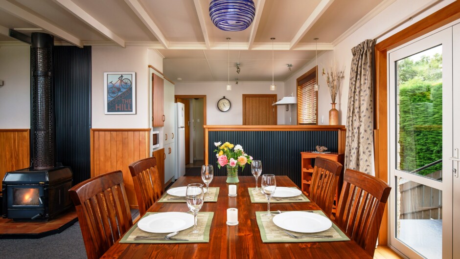 Oak dining table comfortably seats 6 guests.