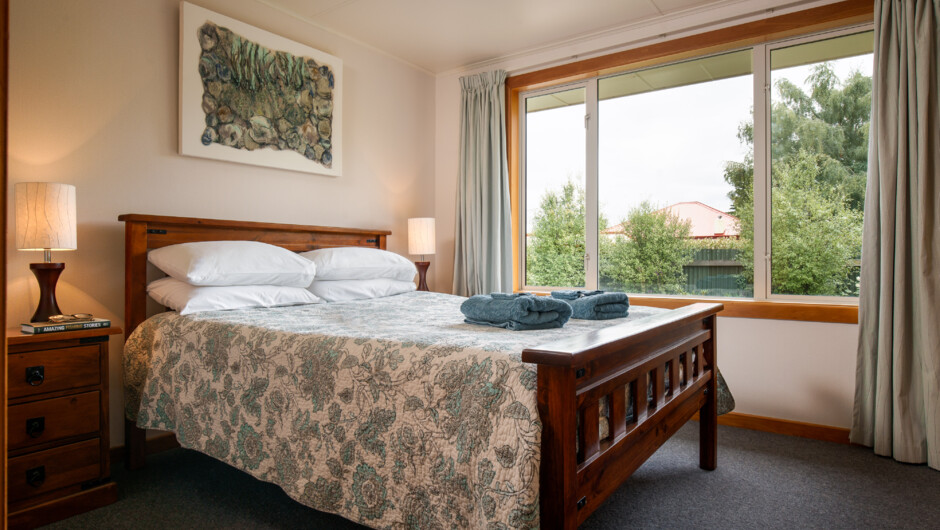 The second bedroom has a queen bed.