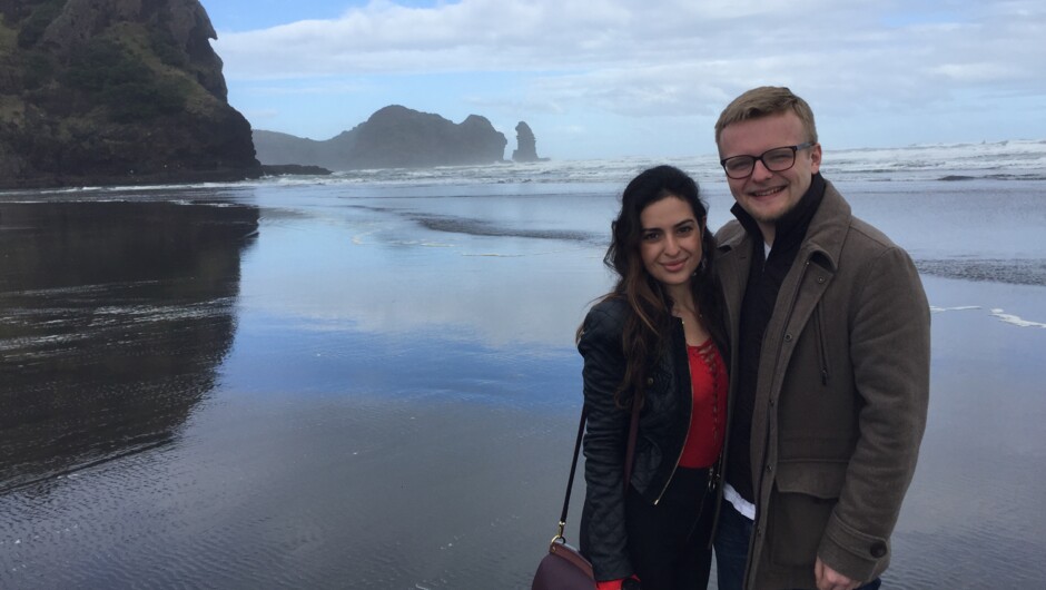 A couple enjoying a moment on North Piha Beach.