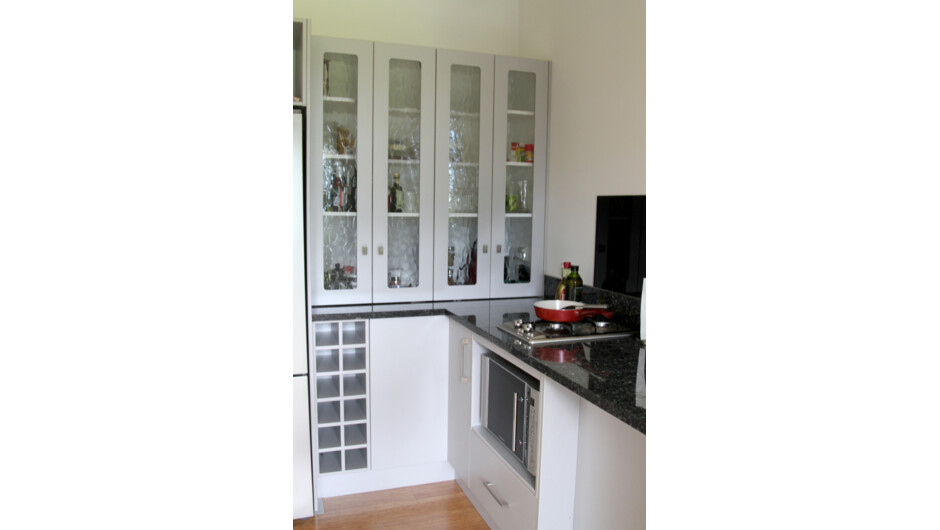 Pantry and stove top. BBQ conveniently close to kitchen preparation area.