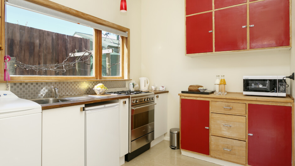 Your fully stocked kitchen and laundry facilities. If you need anything else, ask us at the main house.