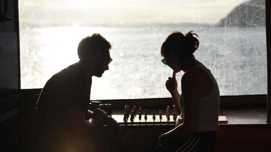 Play a game of chess or strum a guitar in our open plan living area aboard The Rock Overnight Cruise.