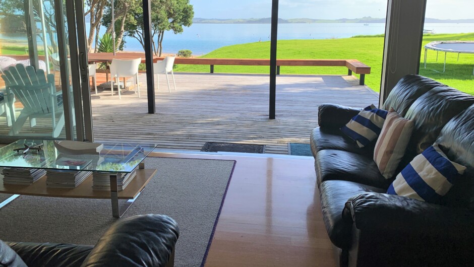 Spacious living room opens onto the deck. The beach house is a perfect home away from home