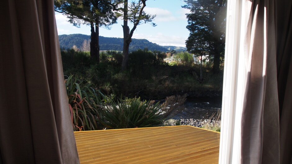 View from Mangawhero French Doors of the Mangawhero River, countryside and Mt Ruapehu.